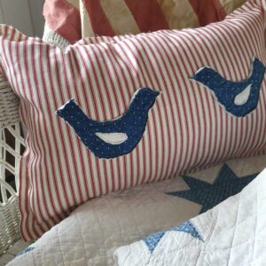 red white and blue bird quilt pillow
