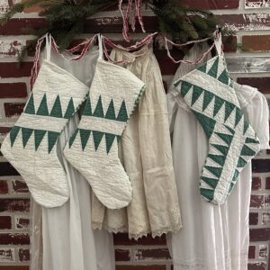 Green and white quilt made into vintage Christmas stockings