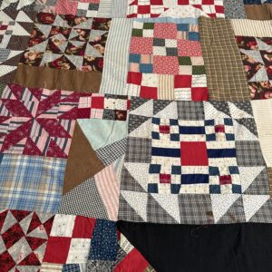 Colorful patchwork quilt top with various patterns
