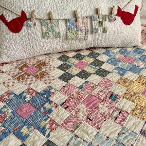 vintage quilt pillow with cardinals and tiny quilts