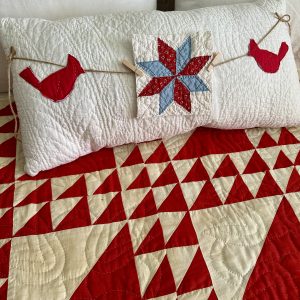 vintage quilt pillow with star and cardinals