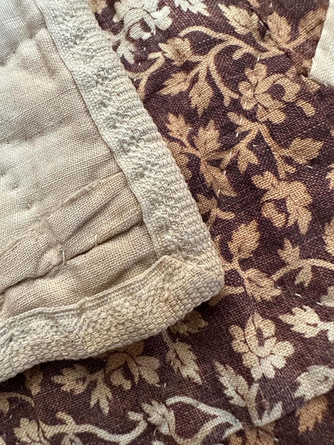 Woven tape binding on in 1840s Quilt
